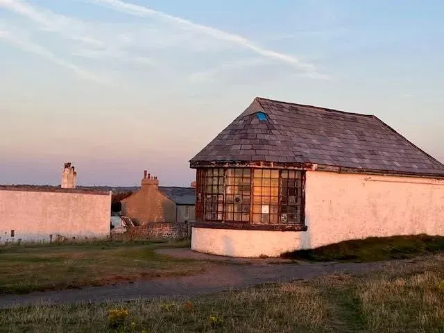 The Telegraph Station lookout illuminated by warm evening light