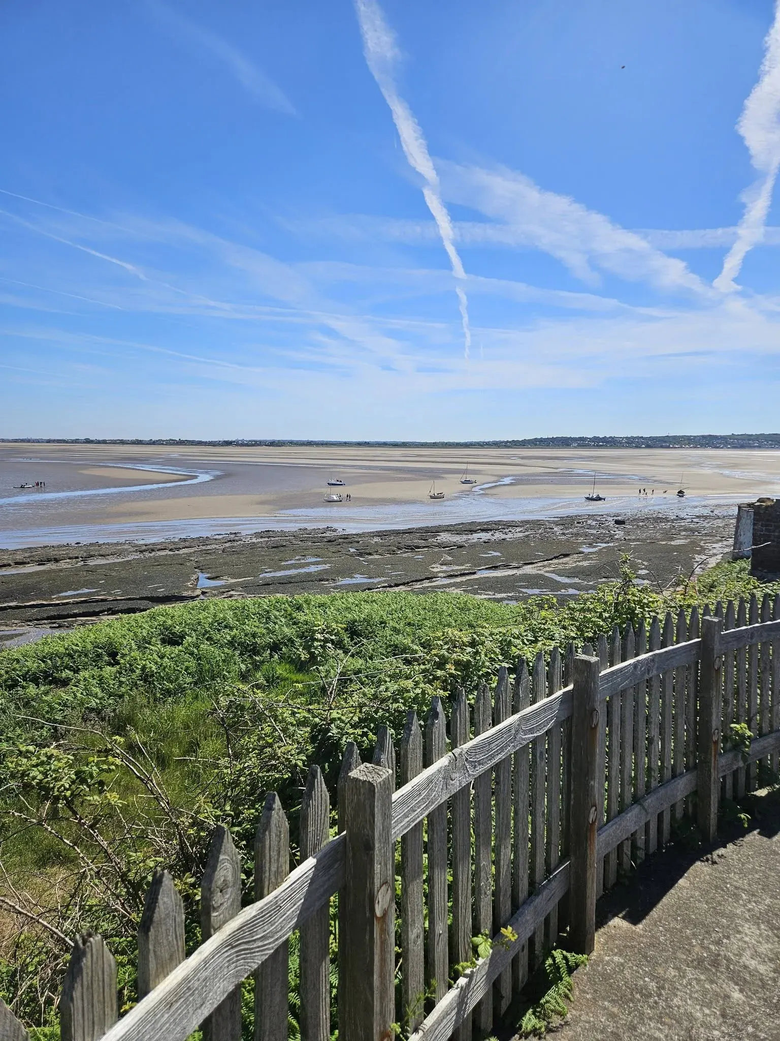A path beside fencing overlooking the estuary and tidal route