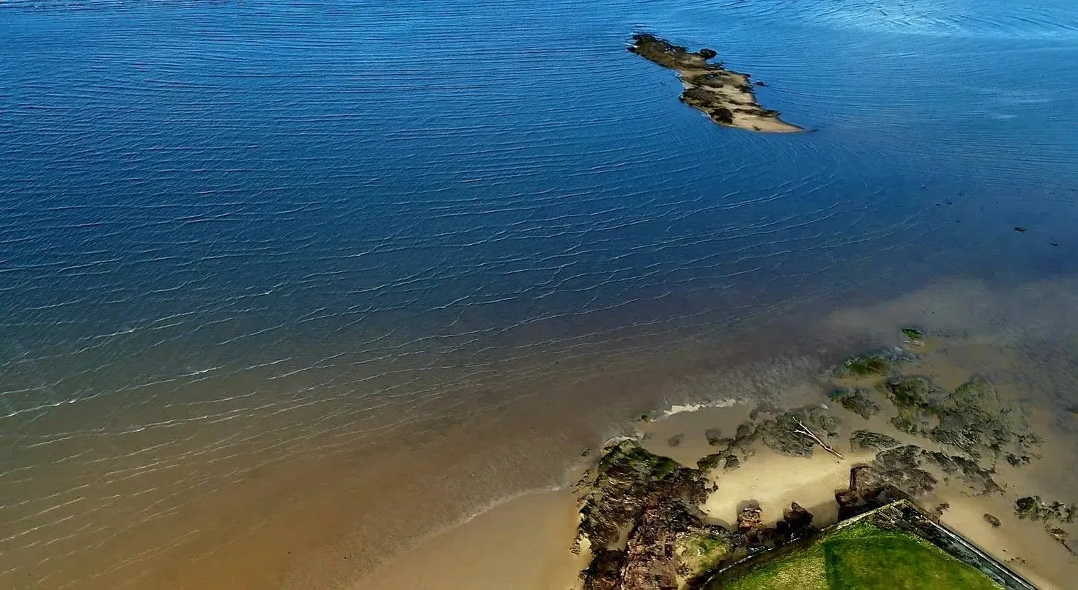 An aerial view showing Hilbre and the smaller islands across the tidal sands